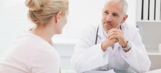 a doctor talking to a woman